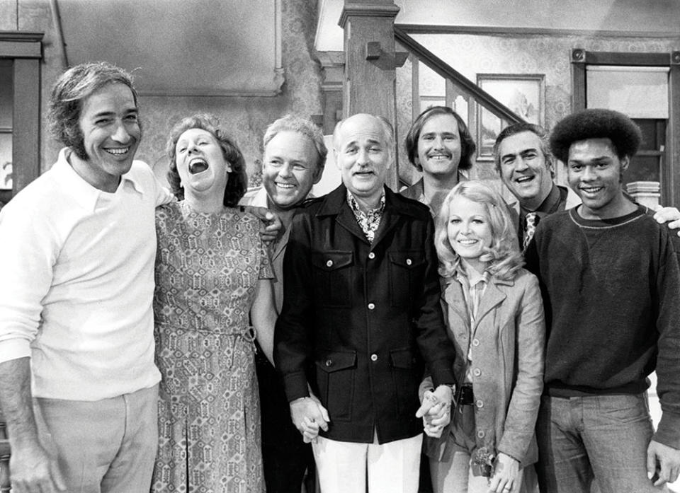 Flanked by the cast and creators of All in the Family in the 1970s. Lear’s seminal sitcom is among his most praised and enduring pieces of work.