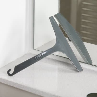 Clean any soap and water residue from your shower screen with this squeegee