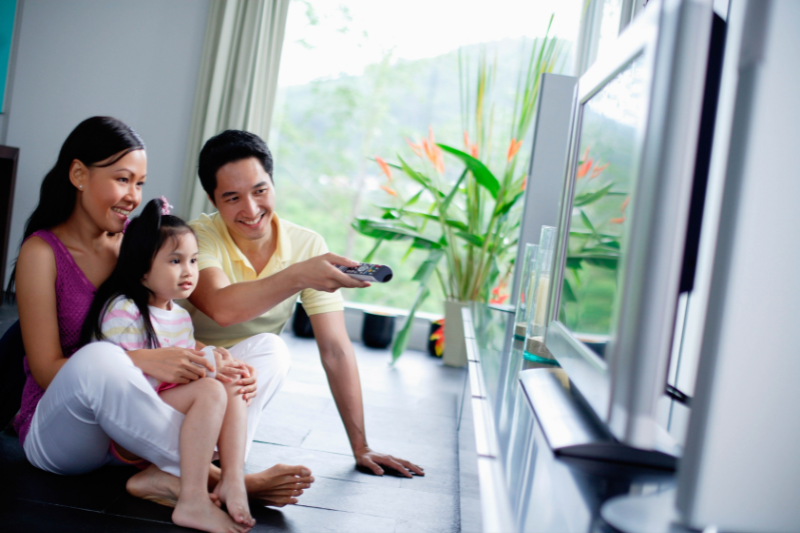 Asian Family Watching TV