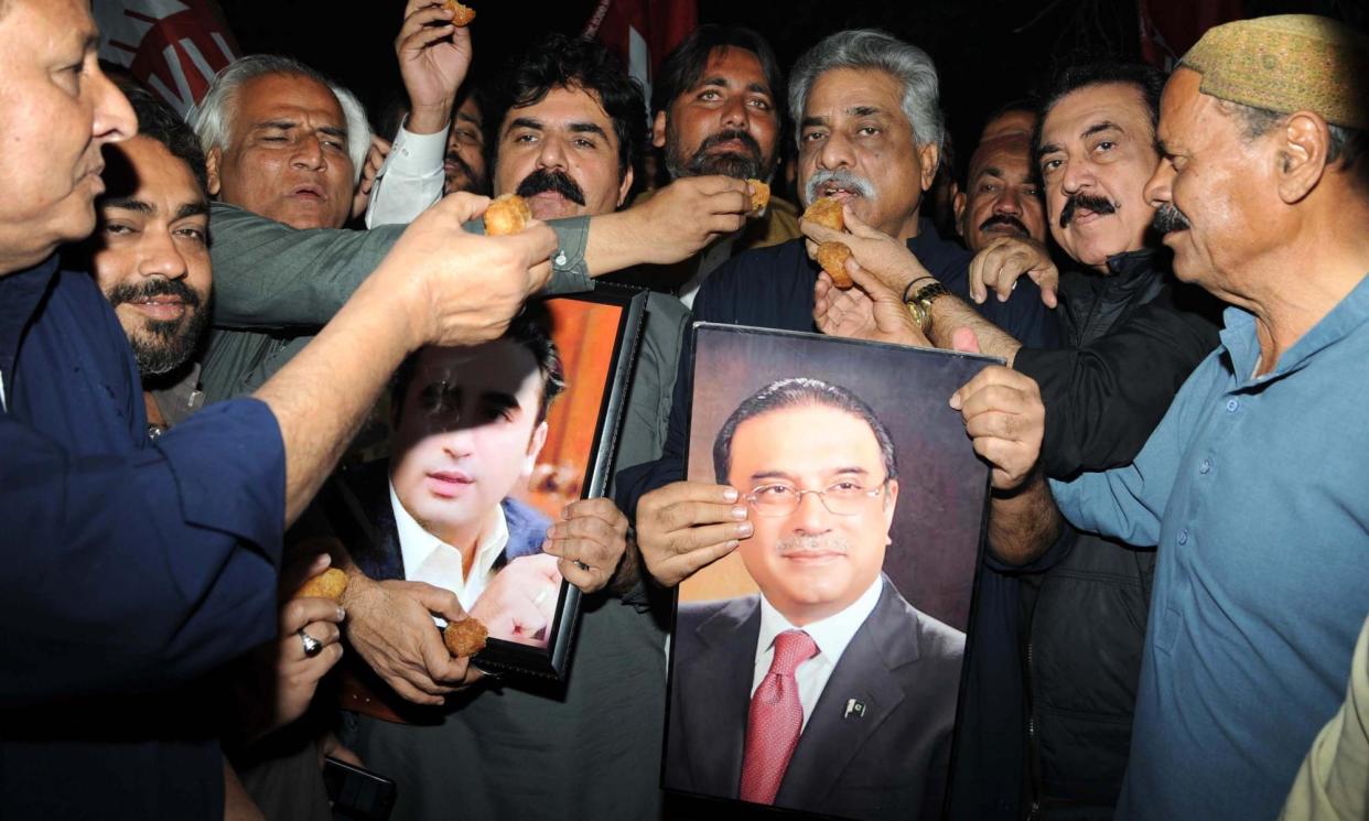 <span>Supporters of the Pakistan People’s party in Hyderabad celebrate the election of Asif Ali Zardari as president for a second time.</span><span>Photograph: Nadeem Khawar/EPA</span>