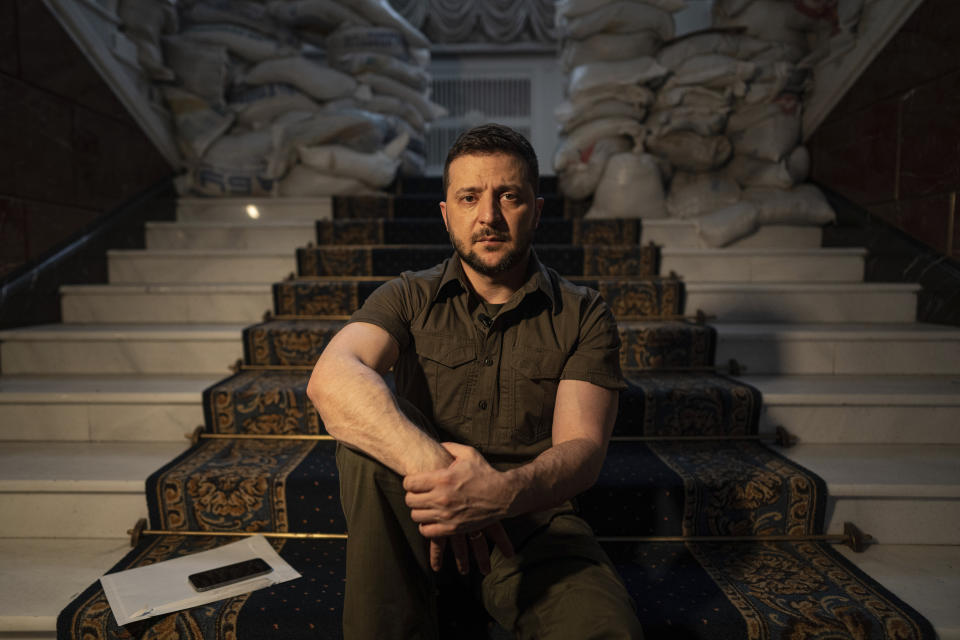 Ukrainian President Volodymyr Zelenskyy speaks during an interview with The Associated Press in his office in Kyiv, Ukraine, Saturday, April 9, 2022. Ukrainian President Volodymyr Zelenskyy says he's committed to pressing for peace despite Russian attacks on civilians that have stunned the world. (AP Photo/Evgeniy Maloletka)