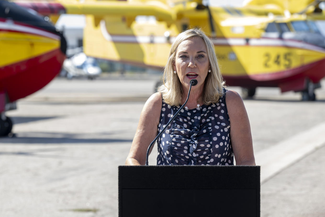 Los Angeles County Supervisor Kathryn Barger at the microphone.