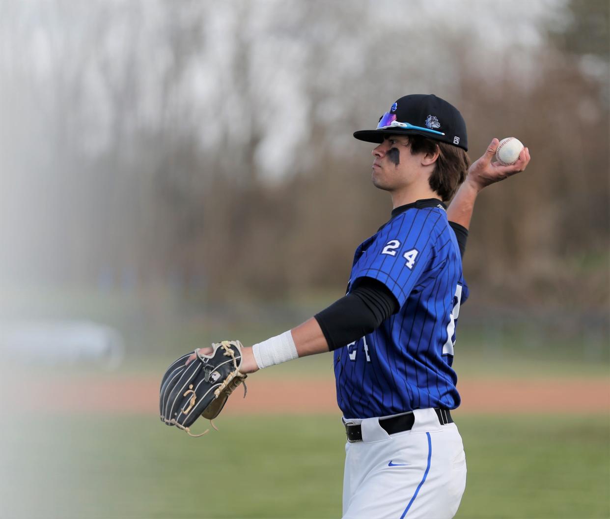 Centerville senior Keegen Schlotterbeck warms up before a game against Monroe Central April 4, 2022.