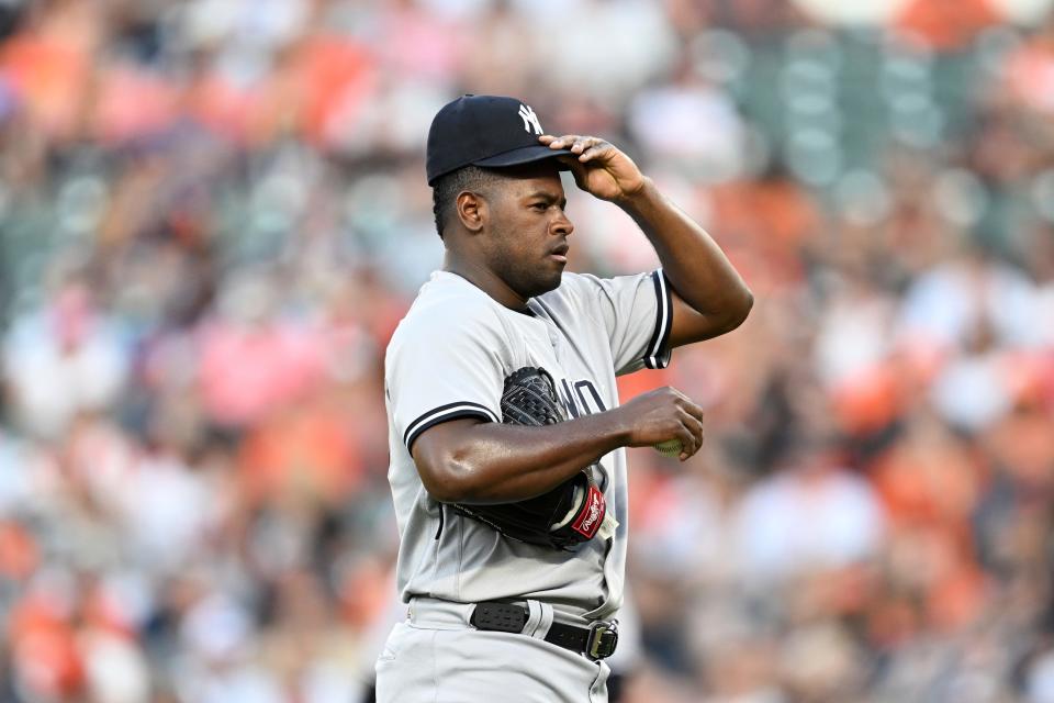 New York Yankees pitcher Luis Severino adjusts his hat after giving up three hits to the Baltimore Orioles in the first inning of a baseball game Sunday, July 30, 2023, in Baltimore. (AP Photo/Gail Burton)