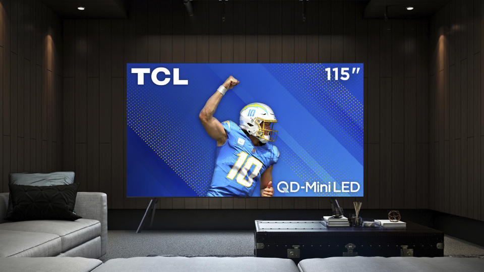 TCL Qm89 on stand in living room