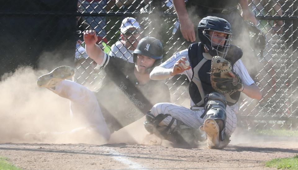Yorktown's Stephen Haglund is tagged out by Eastchester catcher John Russell during their Class A quarterfinal playoff game at Eastchester May 18, 2022. Eastchester won 5-4.