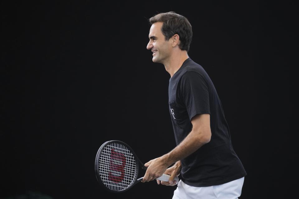 Switzerland's Roger Federer attends a training session ahead of the Laver Cup tennis tournament at the O2 in London, Wednesday, Sept. 21, 2022. Federer appeared earlier at a news conference to discuss his retirement from professional tennis at age 41 after a series of knee operations. He will close his career with a doubles match at the Laver Cup on Friday . (AP Photo/Kin Cheung)