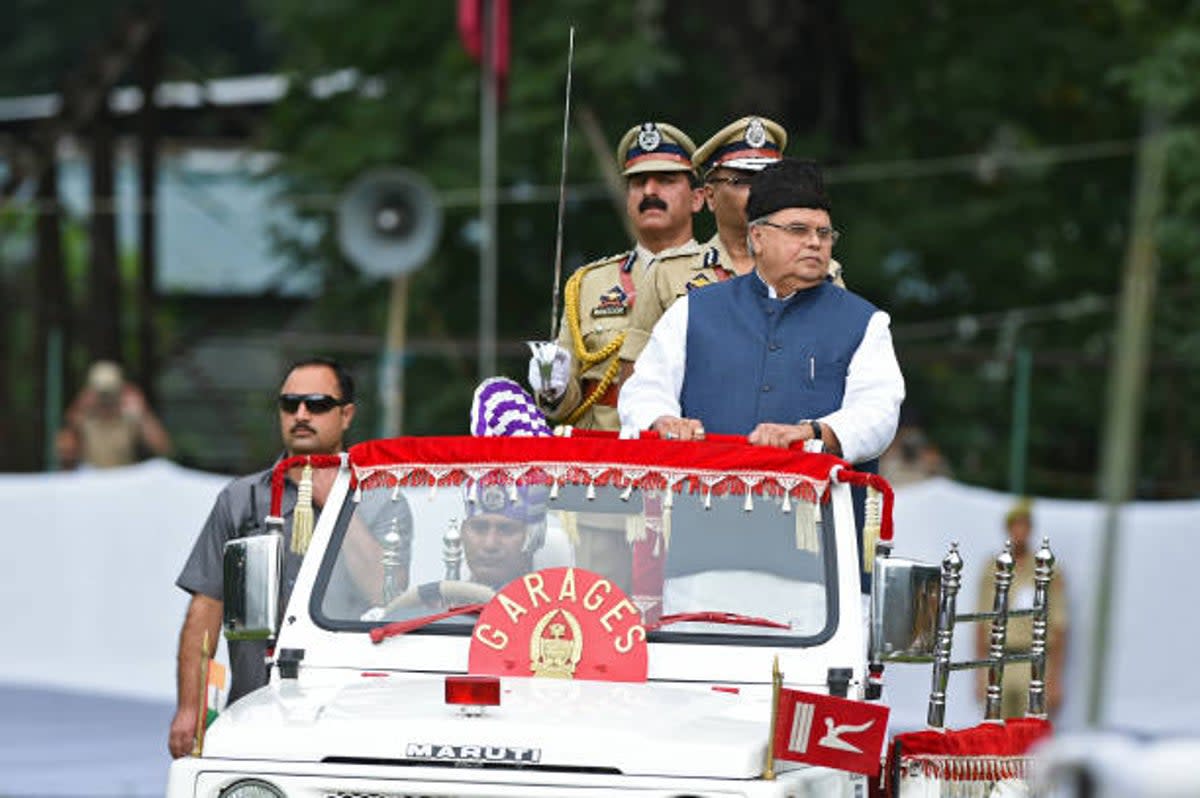 File Jammu and Kashmir state governor Satya Pal Malik (R) reviews a guard of a honour during a ceremony to celebrate India’s 73rd Independence Day (AFP via Getty Images)