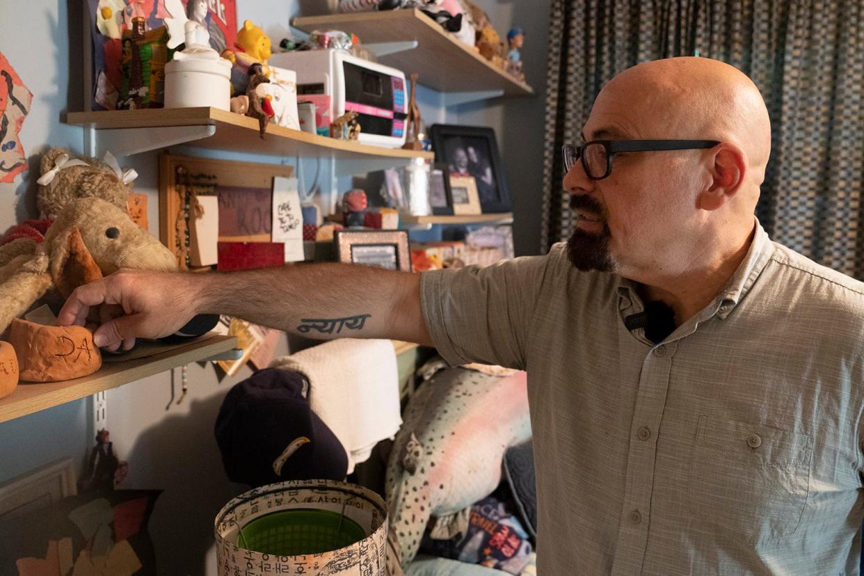 Drew Crecente looks at items in Jennifer's room at his home in Atlanta, Georgia Monday, July 31, 2023. Drew has not made changes to the room since Jennifer's death in 2006.