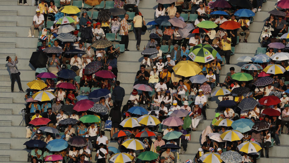 The Catholic faithful wait for Pope Francis to celebrate a Mass at the National Stadium, Thursday, Nov. 21, 2019, in Bangkok, Thailand. (AP Photo/Manish Swarup)