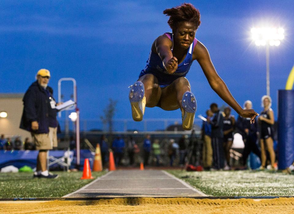 St. Georges' Micaiah Dendy leaps to a first place finish in the Division II Girls Triple Jump event at the DIAA Outdoor Track and Field Championships at Dover High School in Dover on Monday evening.