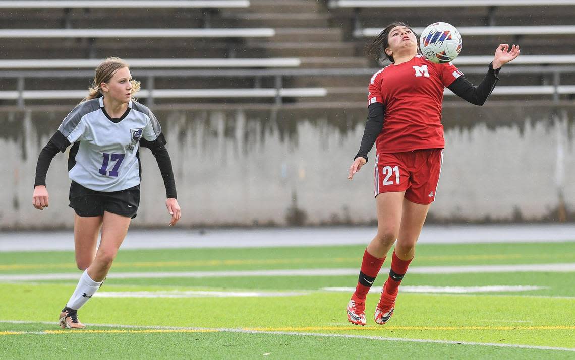 McLane’s Ashlee Salinas, right, tries to control the ball against Desert during their Central Section playoff game at McLane Stadium on Monday, Feb. 27, 2023.