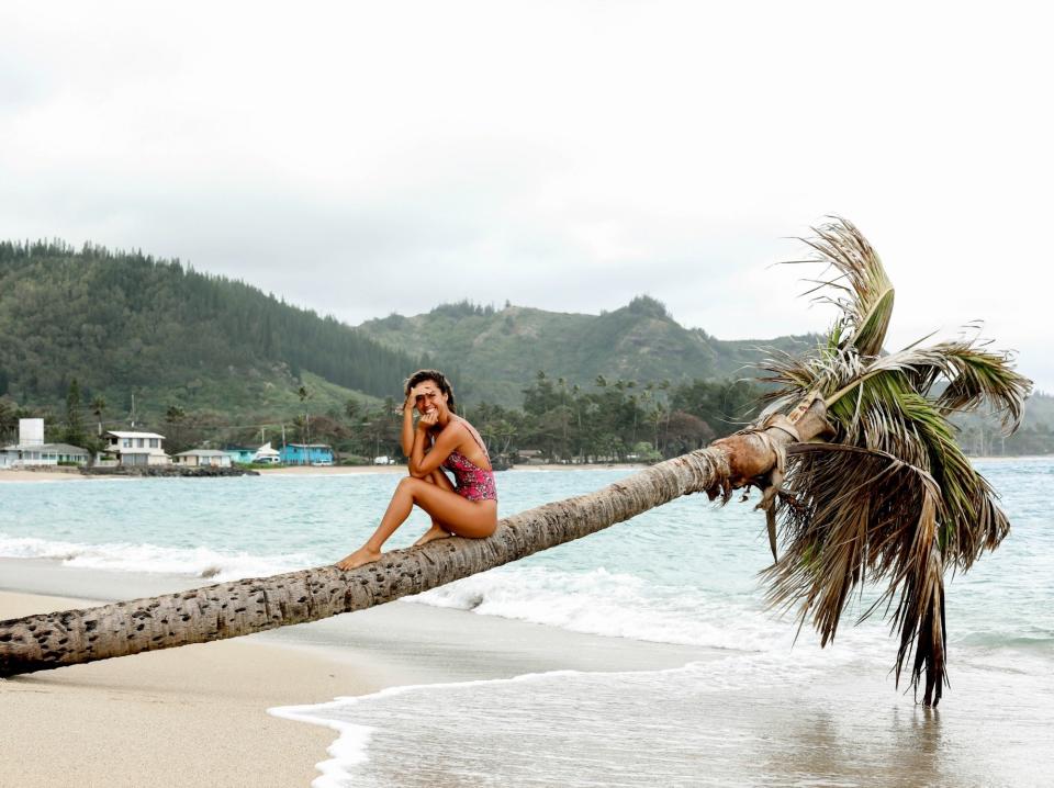 Once you've finished shopping Amber's checklist, get ready to unplug and take in the gorgeous natural scenery. And if you have a moment, grab an Instagram-worthy picture near a palm tree like this one.