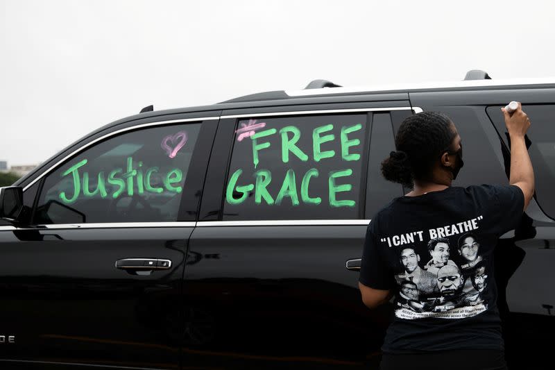 Students protest outside Groves High School in support of a fellow student who was jailed in a Detroit suburb