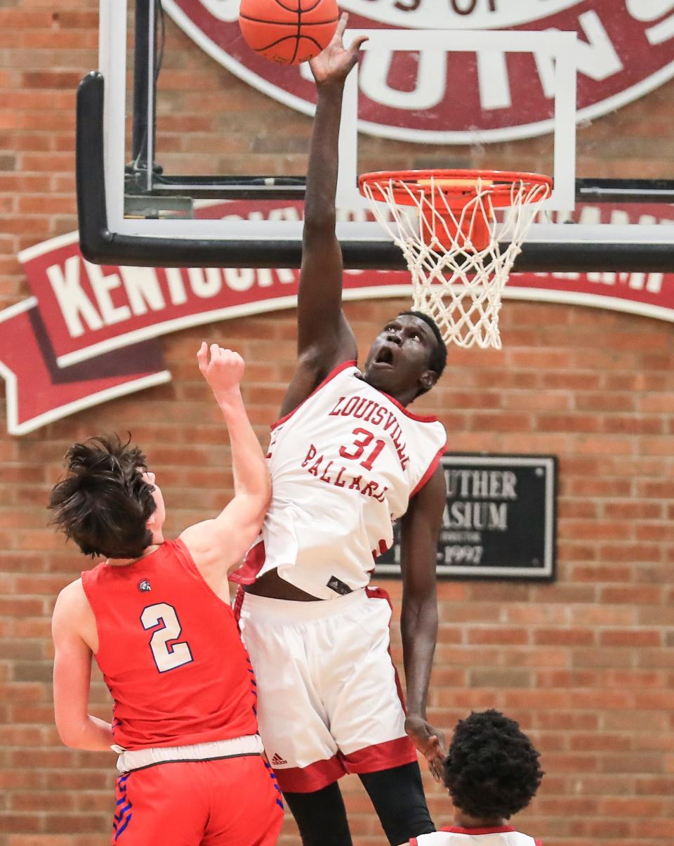 Ballard's Maker Bar blocks the shot by CAL's Cole Hodge Tuesday night. The Bruins won 66-61. Feb. 2, 2021