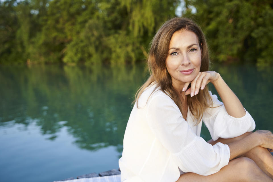 Image of beautiful woman over 50 on the water.