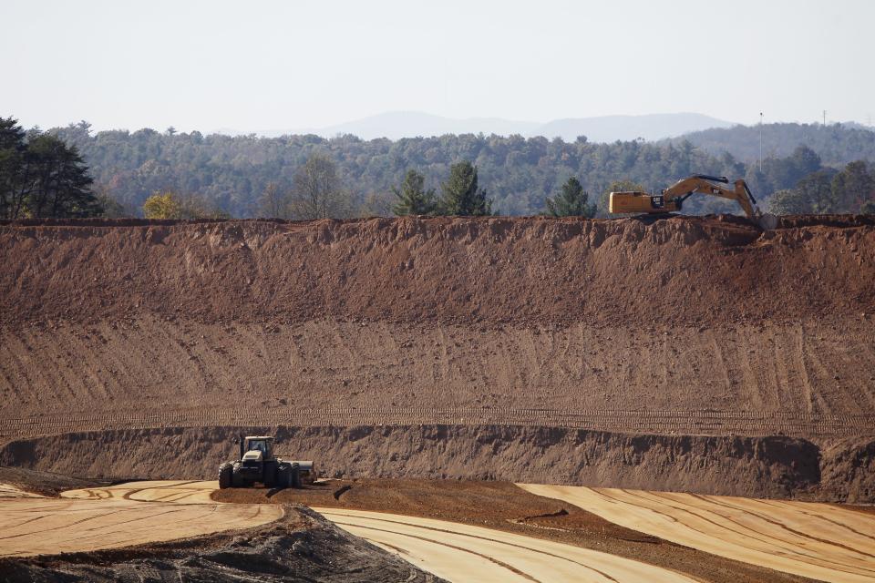 This file photo shows an excavated area that included a coal ash pond at Duke Energy's Lake Julian power plant.