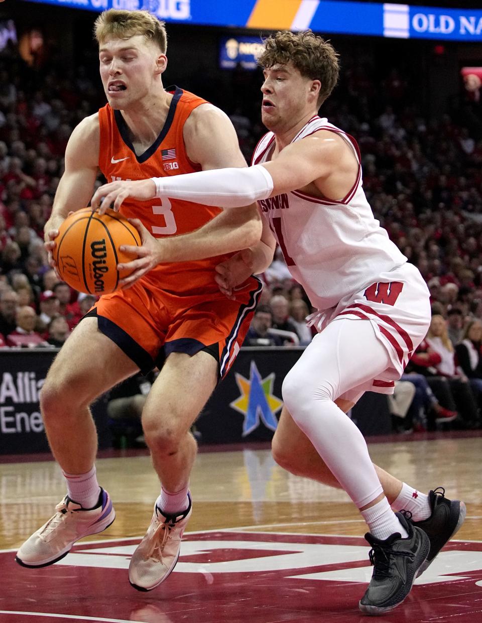 Wisconsin guard Max Klesmit (11) fouls Illinois forward Marcus Domask (3) during the first half of their game Saturday, March 2, 2024 at the Kohl Center in Madison, Wisconsin. Mark Hoffman/Milwaukee Journal Sentinel