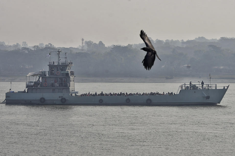 Rohingya refugees travel on a naval vessel to be relocated to to the island of Bhasan Char, in Chattogram, Bangladesh, Saturday, Jan. 30, 2021. Authorities in Bangladesh sent a group of Rohingya refugees to a newly developed island in the Bay of Bengal on Saturday despite calls by human rights groups for a halt to the process. The government insists the relocation plan is meant to offer better living conditions while attempts to repatriate more than 1 million refugees to Myanmar would continue. (AP Photo/Azim Aunon)