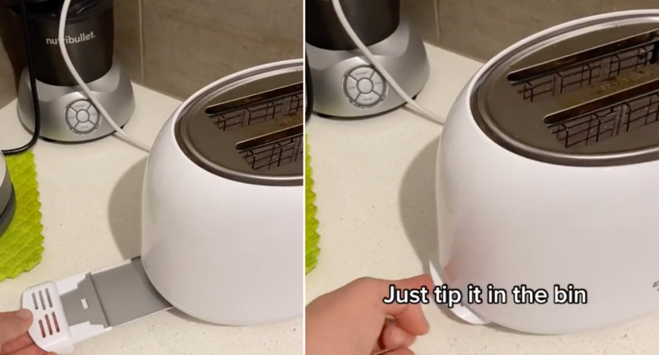Woman's hand reveals compartment on toaster.