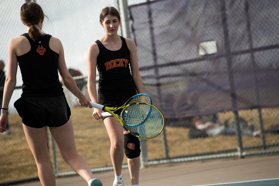 Rocky's Lucia Johnson and Nora Johnson celebrate a point during a city rivalry high school tennis match on March 28 at Fort Collins High School in Fort Collins.