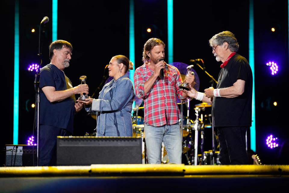 Teddy Gentry and Randy Owen of Alabama are presented with Pinnacle Awards by Elle King and Dierks Bentley as they were honored at CMA Fest at Nissan Stadium on Sunday, June 11, 2023, in Nashville, Tennessee.