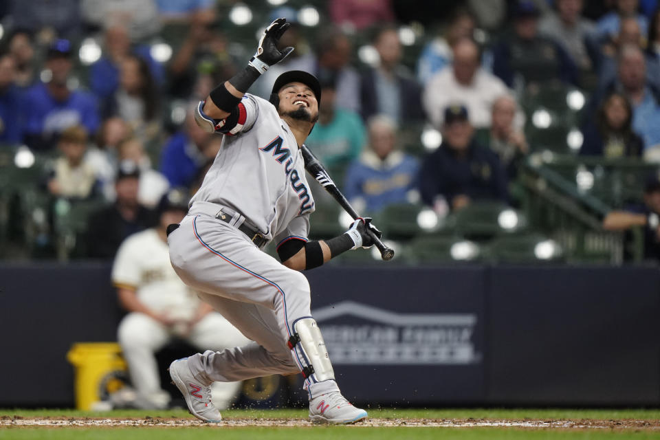 Miami Marlins' Luis Arraez falls down as he fails to check his swing during the third inning of the team's baseball game against the Milwaukee Brewers on Wednesday, Sept. 13, 2023, in Milwaukee. (AP Photo/Aaron Gash)