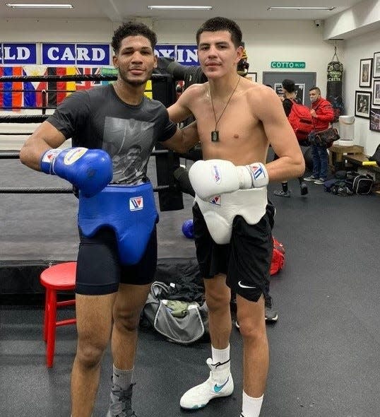 Buena High graduate Ricardo Ruvalcaba (right) poses with unbeaten junior welterweight Elvis Rodriguez. Ruvalcaba will fight Saturday night at Commerce Casino.