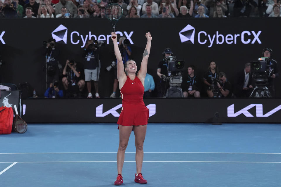Aryna Sabalenka of Belarus celebrates after defeating Zheng Qinwen of China in the women's singles final at the Australian Open tennis championships at Melbourne Park, Melbourne, Australia, Saturday, Jan. 27, 2024. (AP Photo/Andy Wong)