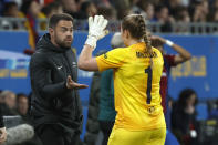 Brann's head coach Martin Peter Ho, left, and Brann's goalkeeper Aurora Mikalsen react during the women's Champions League quarterfinals, second leg, soccer match between FC Barcelona and SK Brann Kvinner at the Estadi Johan Cruyff in Barcelona, Spain, Thursday, March 28, 2024. (AP Photo/Joan Monfort)