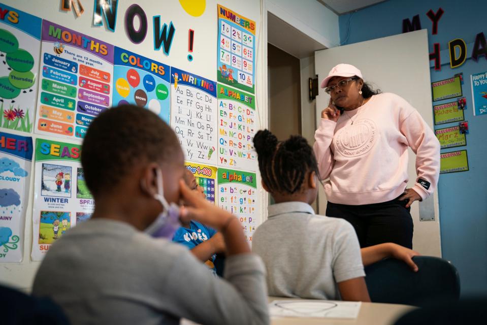 Day care owner Betty Henderson, 51, talks with children at Angels of Essence Child Care Centre in Detroit on Friday, Oct. 21, 2022.