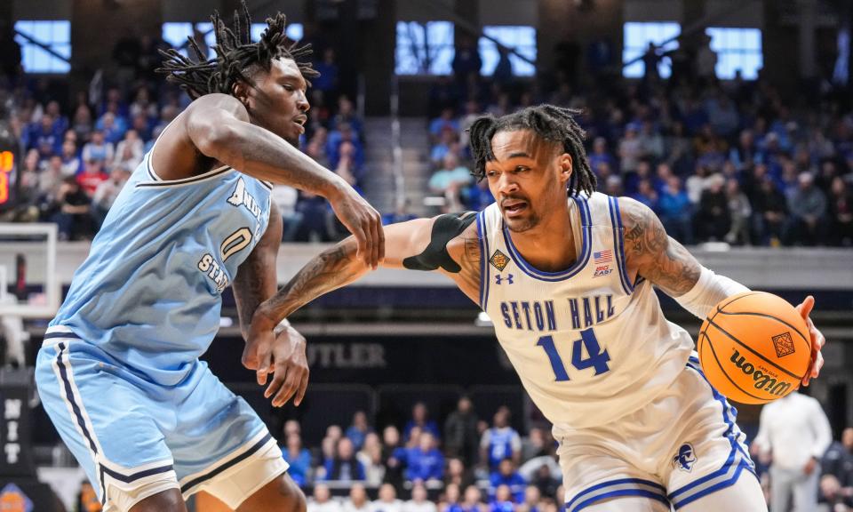 Seton Hall Pirates guard Dre Davis (14) rushes up the court against Indiana State Sycamores guard Xavier Bledson (0) on Thursday, April 4, 2024, during the NIT championship game at Hinkle Fieldhouse in Indianapolis.