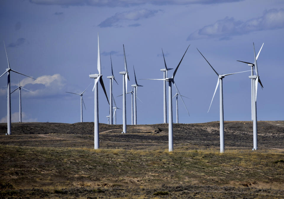 Wind turbines are seen at Duke Energy's Top of the World energy facility, April 23, 2013, in Rollings Hills, Wyo. The number of eagles killed at the site increased in the immediate years after Duke was prosecuted for killing eagles last decade, but company officials say the death rate has since fallen. (AP Photo/Matthew Brown)