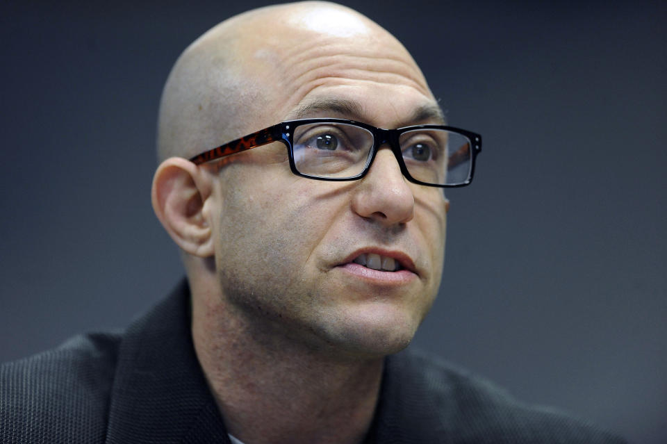 FILE - In this Nov. 14, 2014 file photo, Jeremy Richman, father of Sandy Hook Elementary school shooting victim Avielle Richman, addresses the Sandy Hook Advisory Commission in Newtown, Conn. Richman was found dead early Monday, March 25, 2019, at the town hall in Newtown, where he had an office. The chief medical examiner's office was to perform an autopsy Monday. Richman’s death comes as officials in Parkland, Florida, are publicizing counseling services after two survivors of a high school massacre there killed themselves. (AP Photo/Jessica Hill, File)