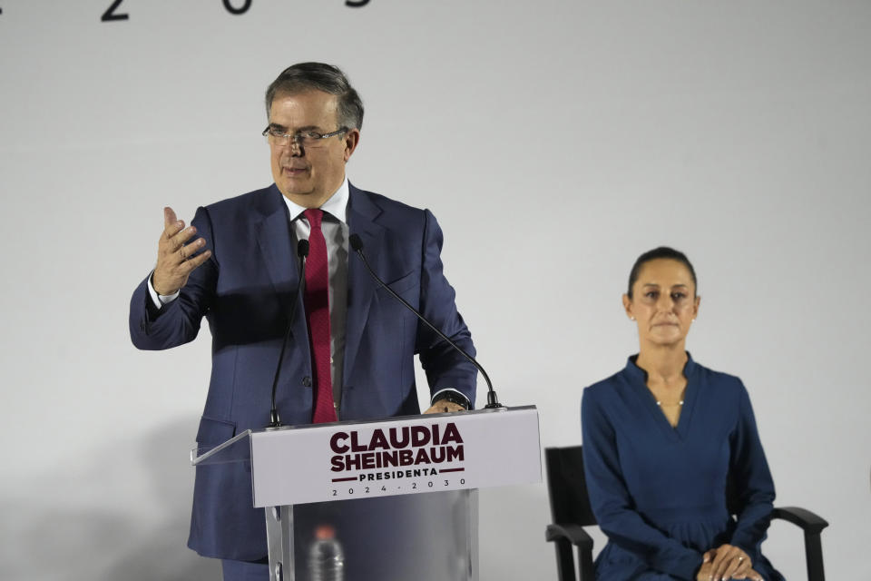 Mexico's former Foreign Affairs Secretary Marcelo Ebrard speaks at the press conference announcing incoming President Claudia Sheinbaum's Cabinet members, in Mexico City, Thursday, June 20, 2024. Sheinbaum, right, chose Ebrard as her administration’s economy secretary. (AP Photo/Marco Ugarte)