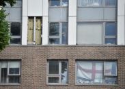 Cladding is seen on the Burnham Tower residential block, from where residents were evacuated as a precautionary measure following concerns over the type of cladding used on the outside of the building on the Chalcots Estate in north London, Britain, June 24, 2017. REUTERS/Hannah McKay