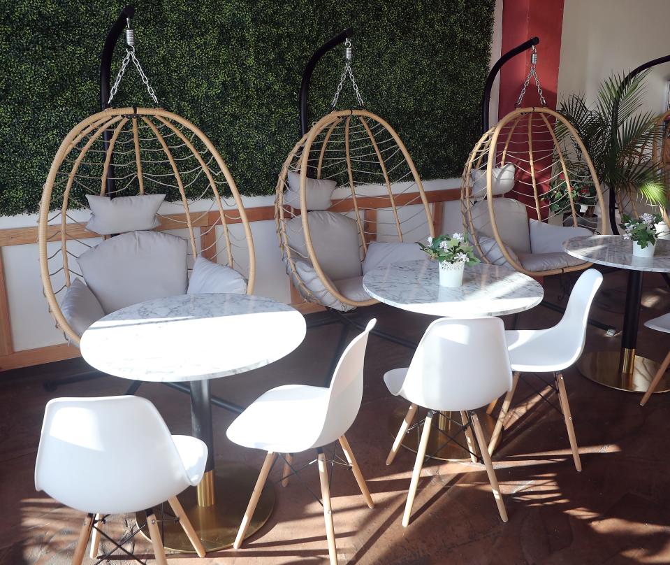 Swing chairs line the wall at Poke & Prep in downtown Bremerton on Thursday, Jan. 11, 2024.