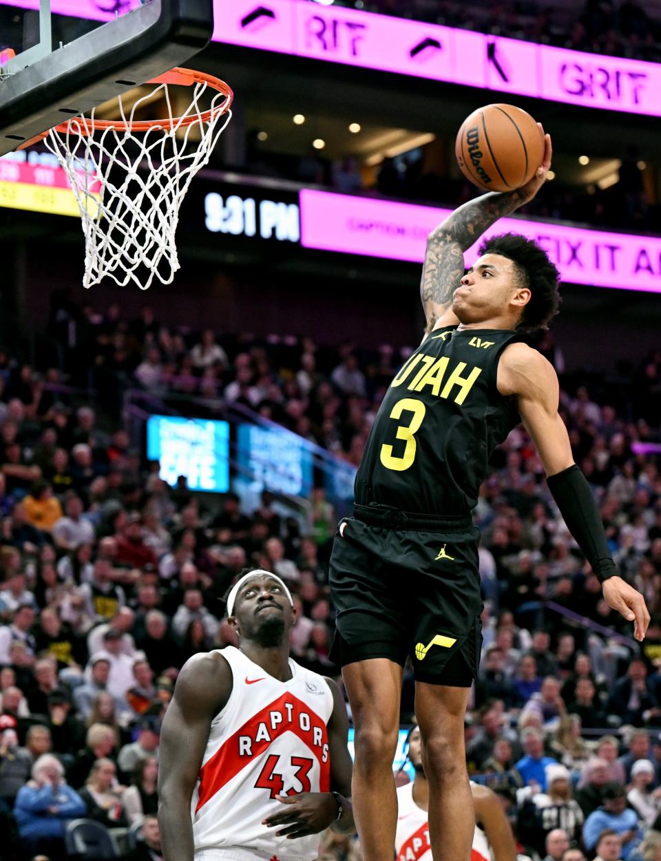 Utah Jazz guard Keyonte George (3) goes hard at the hoop for a dunk over Toronto Raptors forward <a class="link " href="https://sports.yahoo.com/nba/players/5658" data-i13n="sec:content-canvas;subsec:anchor_text;elm:context_link" data-ylk="slk:Pascal Siakam;sec:content-canvas;subsec:anchor_text;elm:context_link;itc:0">Pascal Siakam</a> (43) as the Jazz and Raptors play at the Delta Center in Salt Lake City on Friday, Jan. 12, 2024. Utah won 145-113. | Scott G Winterton, Deseret News