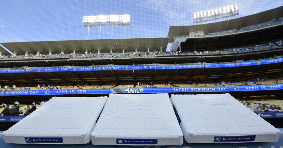 Bases bearing Jackie Robinson's name wait to be installed on Jackie Robinson Day prior to a baseball game between the Los Angeles Dodgers and the Cincinnati Reds, Monday, April 15, 2019, in Los Angeles. (AP Photo/Mark J. Terrill)