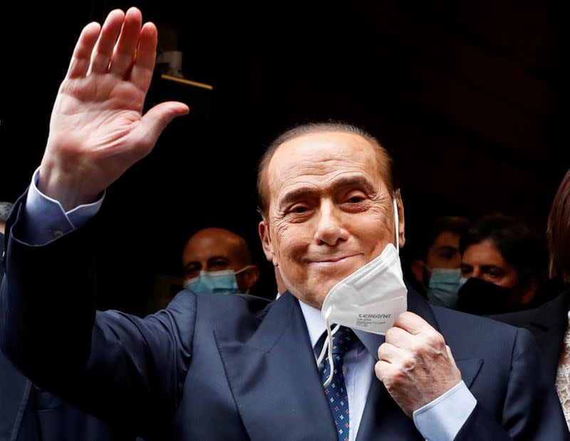 FILE PHOTO: Berlusconi arrives at Montecitorio Palace for talks on forming a new government, in Rome