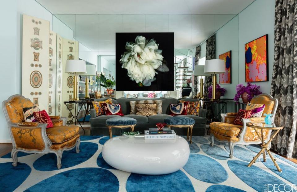 <p>Like green grass and spring flowers outside, the turn in seasons calls for something bright underfoot. In the main living room of hairstylist Marcos Proença's <a href="https://www.elledecor.com/design-decorate/house-interiors/a9143/sao-paulo-house-tour/" rel="nofollow noopener" target="_blank" data-ylk="slk:São Paulo duplex;elm:context_link;itc:0" class="link ">São Paulo duplex</a>, which was designed by Fabrizio Rollo, the custom rug is Tibetan, but we can help you <a href="https://www.elledecor.com/design-decorate/room-ideas/tips/g884/living-room-rugs/" rel="nofollow noopener" target="_blank" data-ylk="slk:shop the look;elm:context_link;itc:0" class="link ">shop the look</a>. </p>