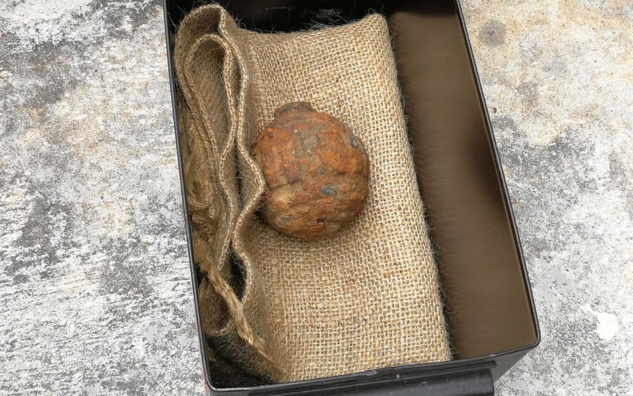 The First World War-era German hand grenade that was found among a shipment of French potatoes bound for a crisp factory - AFP