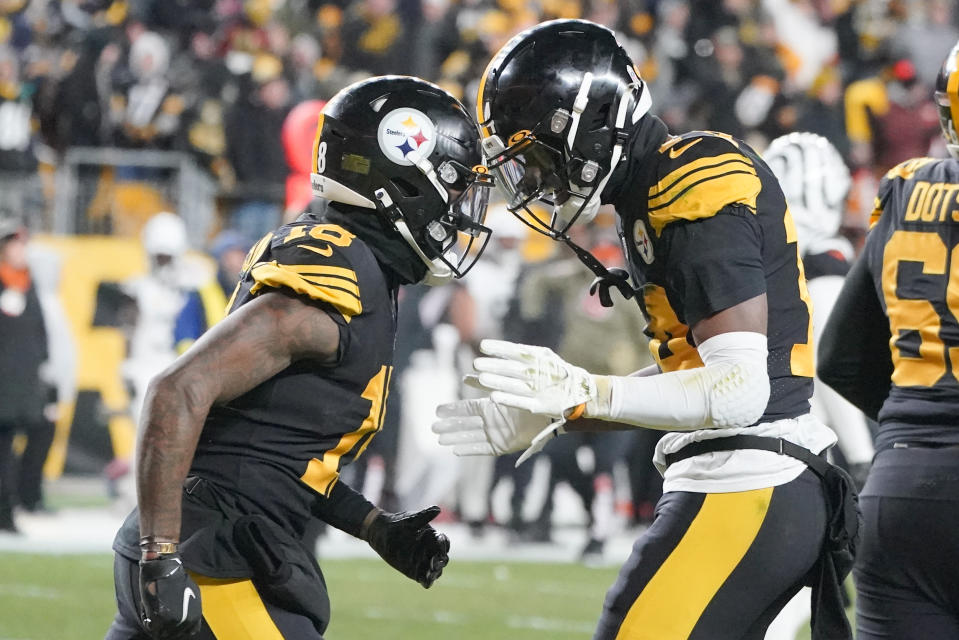 Pittsburgh Steelers wide receiver George Pickens (14), right, celebrates with Diontae Johnson after making a catch for a touchdown against the Cincinnati Bengals during the first half of an NFL football game, Sunday, Nov. 20, 2022, in Pittsburgh. (AP Photo/Gene J. Puskar)