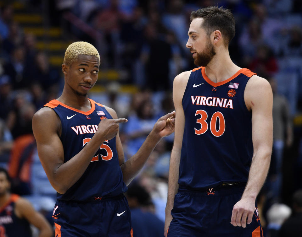 Mamadi Diakite (L) jokes with teammate Jay Huff of the Virginia Cavaliers during the second half of their game against the North Carolina Tar Heels on Feb. 15. (Grant Halverson/Getty Images)