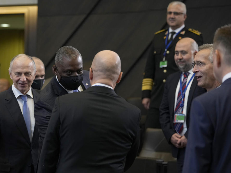 Norway's Defense Minister Odd Roger Enoksen, center, is greeted by United States Defense Secretary Lloyd J. Austin III, third left, during a meeting of NATO defense ministers at NATO headquarters in Brussels, Thursday, Oct. 21, 2021. NATO defense ministers gather for their fall meeting to assess the fallout of Moscow's closure of its mission to the alliance and an overall worsening of relations with Moscow. (AP Photo/Virginia Mayo)