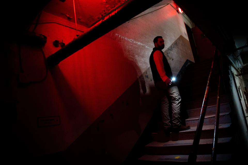 Matt Loesche, distillery sales for Brushy Mountain Distillery, leads the way up a flight of stairs and to the cafeteria inside the Historic Brushy Mountain State Penitentiary in Petros, Tenn., on Thursday, March 2, 2023. The former state penitentiary is home to Brushy Mountain Distillery. 