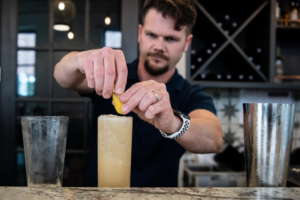 Ben Krauss, manager of The Boiler Room, serves up a Lavender Lemonade cocktail Thursday, July 29, 2021.