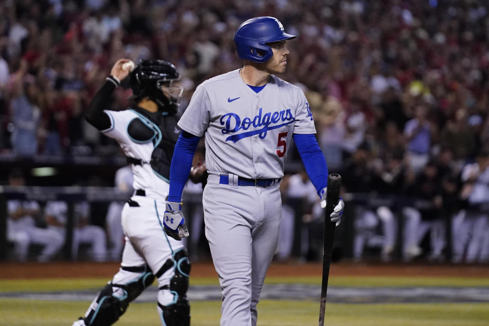 Los Angeles Dodgers' Freddie Freeman, center, reacts after striking out during the eighth inning in Game 3 of a baseball NL Division Series against the Arizona Diamondbacks, Wednesday, Oct. 11, 2023, in Phoenix. (AP Photo/Ross D. Franklin)