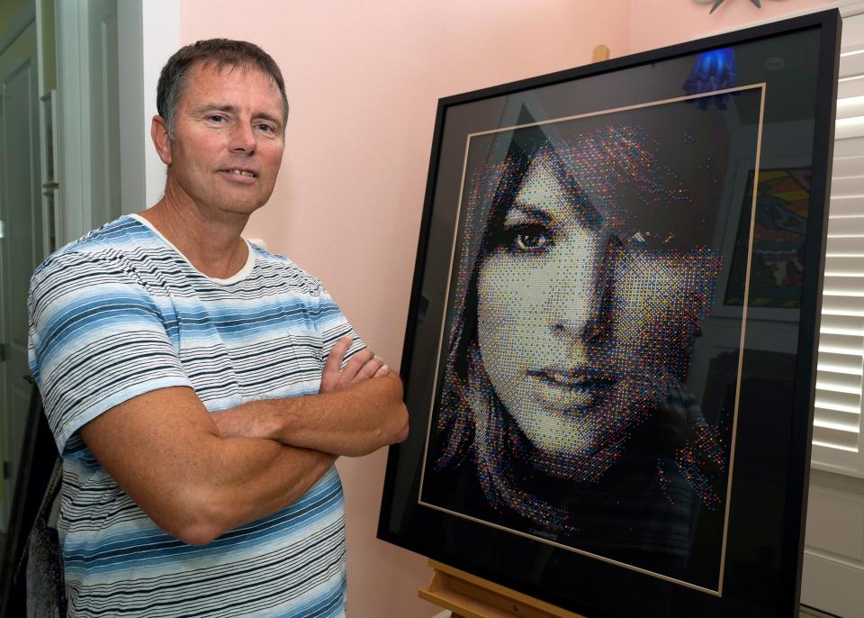 John Darovitz with his pointillist art of a likeness of Taylor Swift from his home in Daytona Beach, Monday, May 6, 2024.