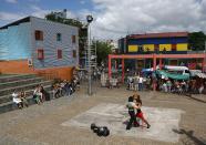 A couple dance to tango music in Buenos Aires. Tango was born in the suburbs of the Argentine capital, which is known as the Paris of the South.